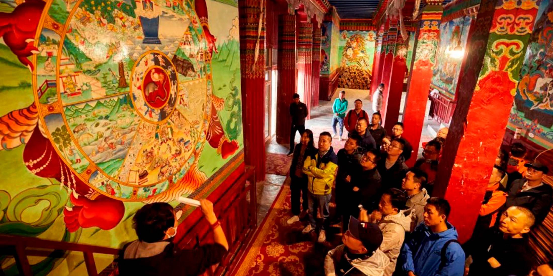 Renqing explaining Tibetan culture enthusiastically to the guests