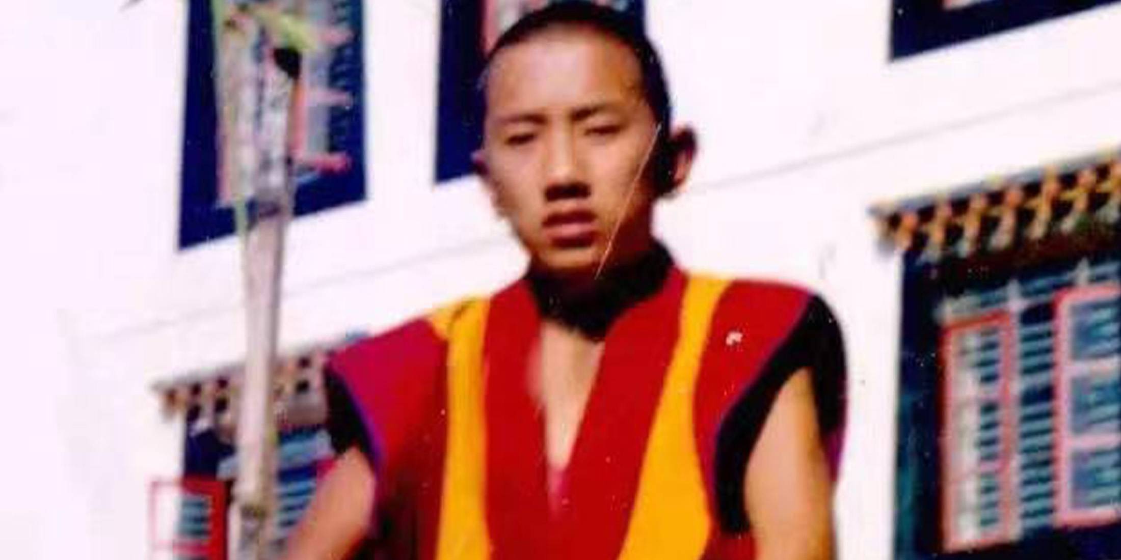 Luosang in Buddhist costume as a teen 